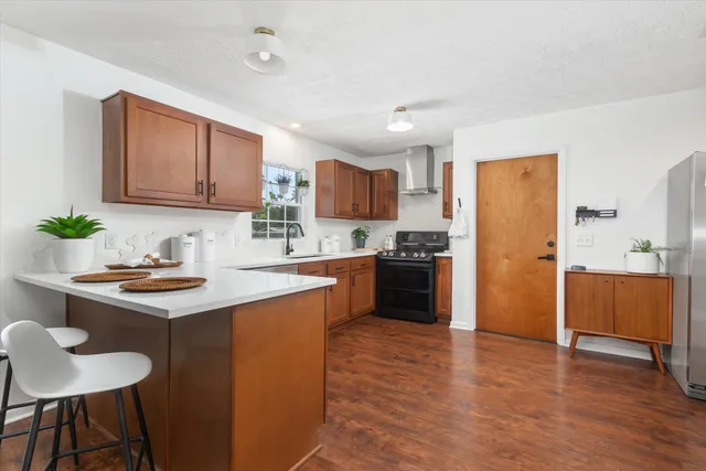a kitchen with a refrigerator and a sink