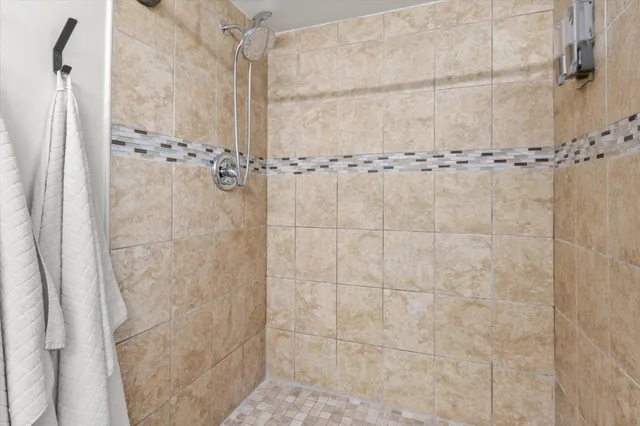 a spacious bedroom with a bed and a table