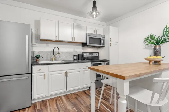 a view of a chairs and table in a patio