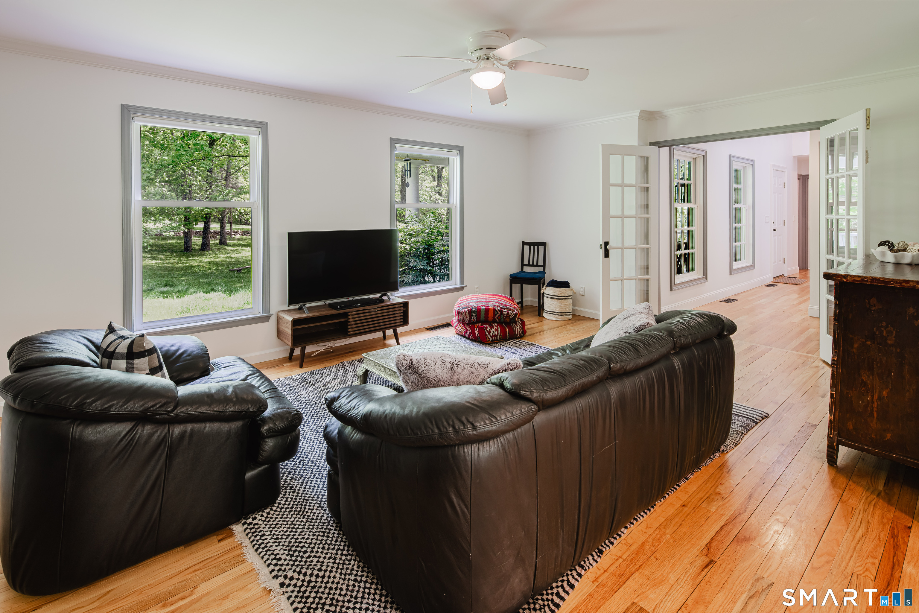 3 Partridge Trail Sherman, CT 06784 - Photo 20 of 37 a living room with furniture and a flat screen tv
