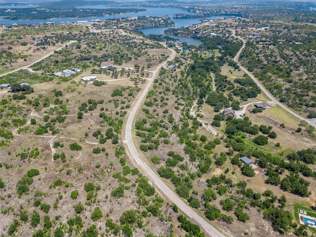 8021 Hells Gate Loop Strawn, TX 76475 - Photo 30 of 39 Birds eye view of property with a water view