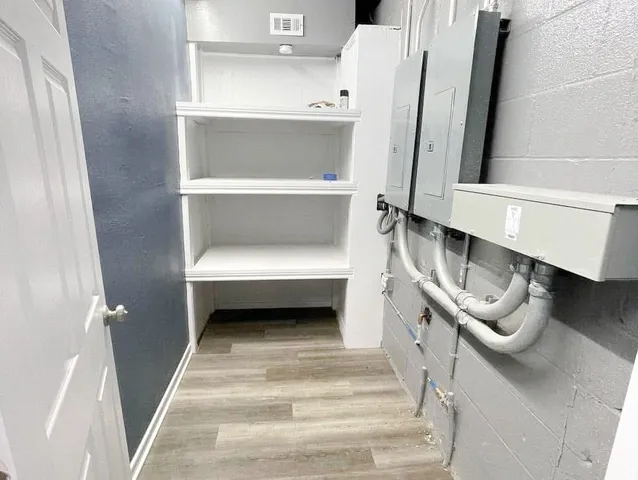 a bathroom with a sink a toilet and a window