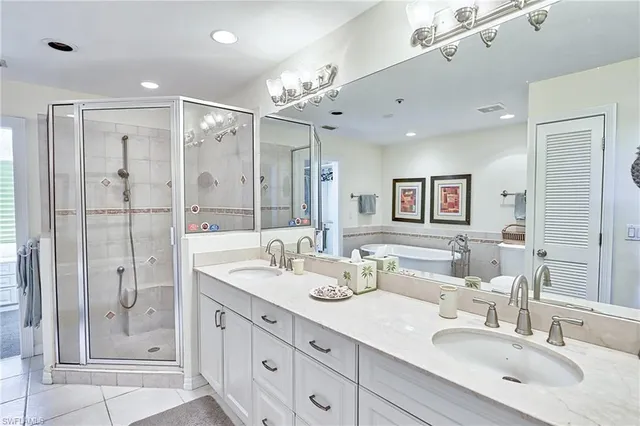 a bathroom with a double vanity sink mirror and double