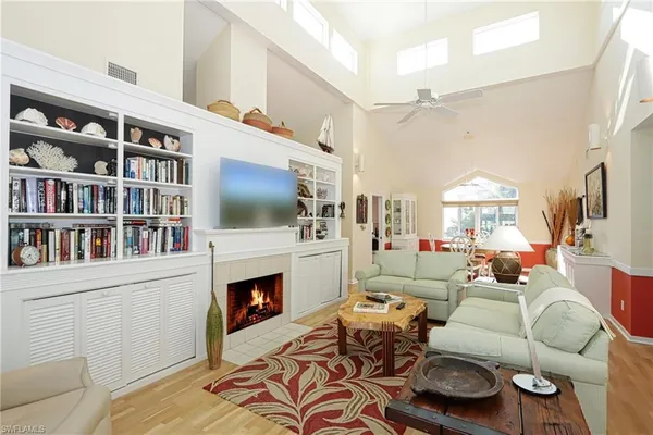 a living room with furniture fireplace and a flat screen tv