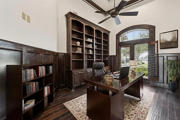 a work room with furniture and book shelf