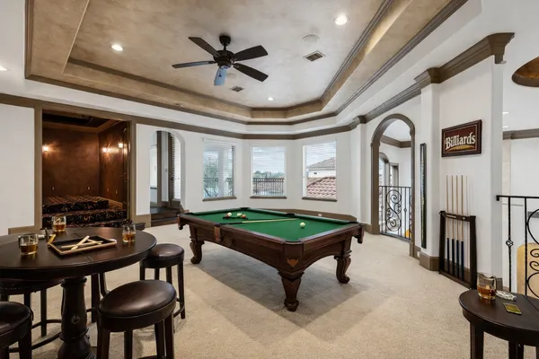 a living room with furniture a rug and a flat screen tv