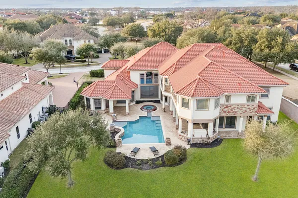 an aerial view of a house with a garden