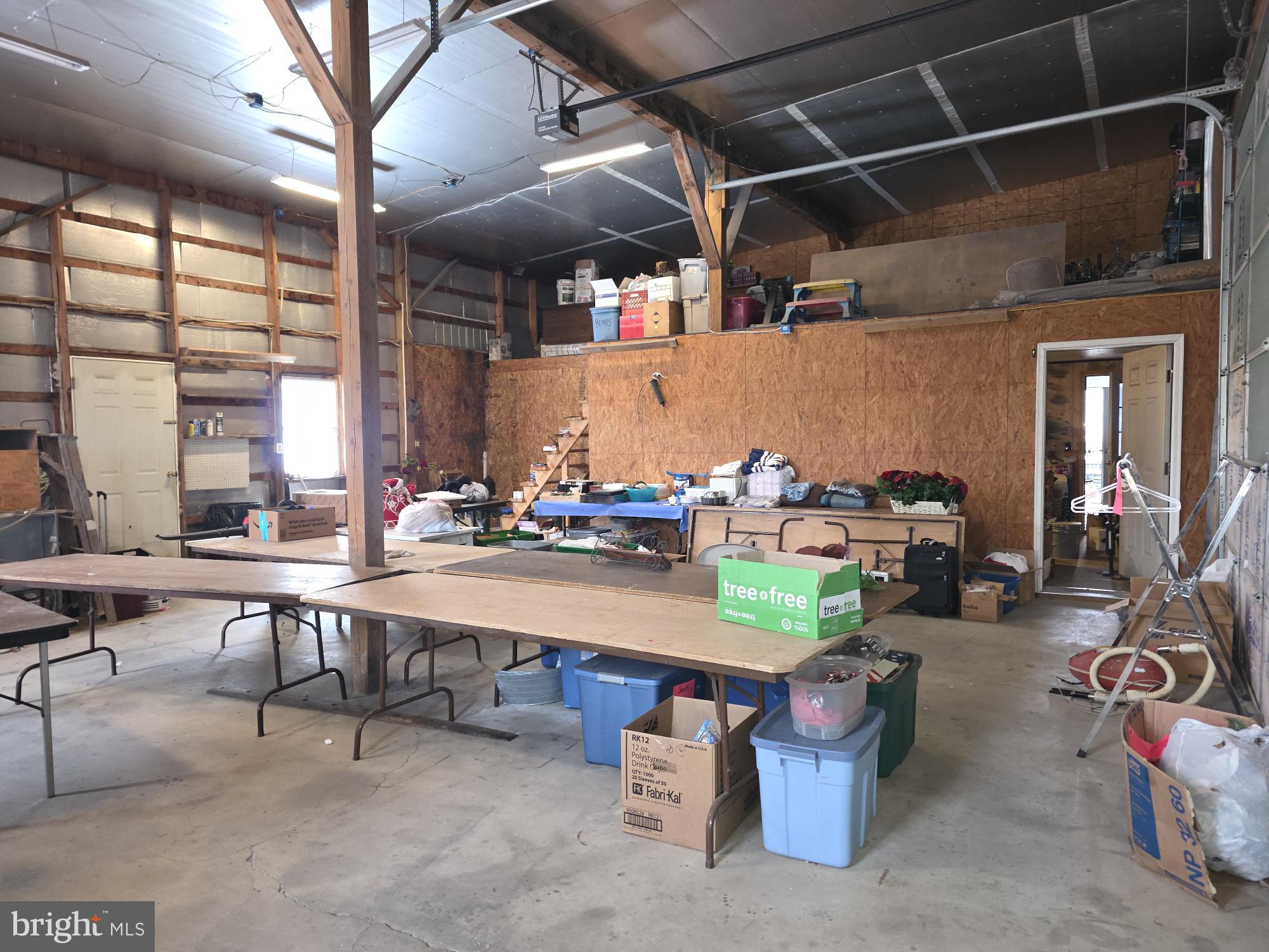 8370 Rte 104 Mount Pleasant Mills, PA 17853 - Photo 7 of 9 a room with lots of furniture and a chandelier