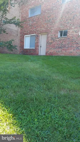 a brick house with a yard
