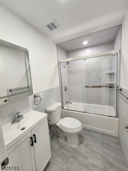 189 Main Street, Unit 3B Paterson, NJ 07505 - Photo 6 of 6 a bathroom with a sink toilet and shower