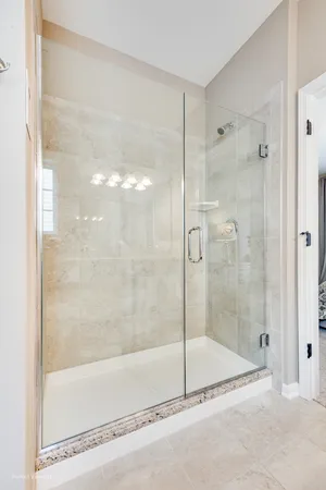 a bathroom with a shower and a bath tub