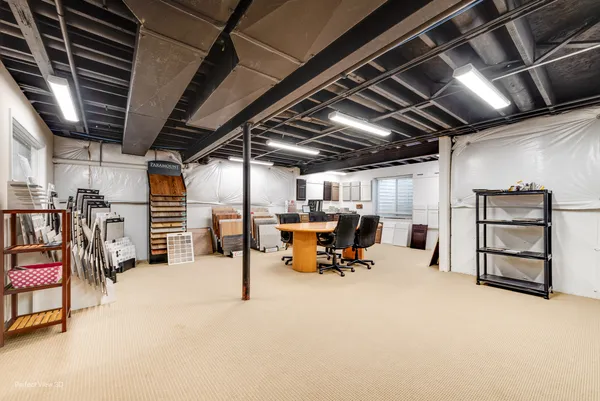 a kitchen with a sink a counter and appliances