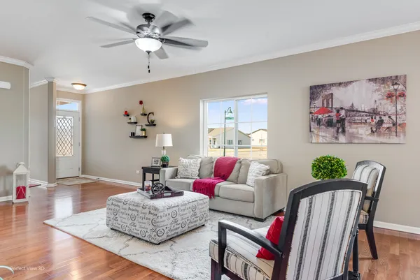 a living room with furniture or wooden floor and a chandelier