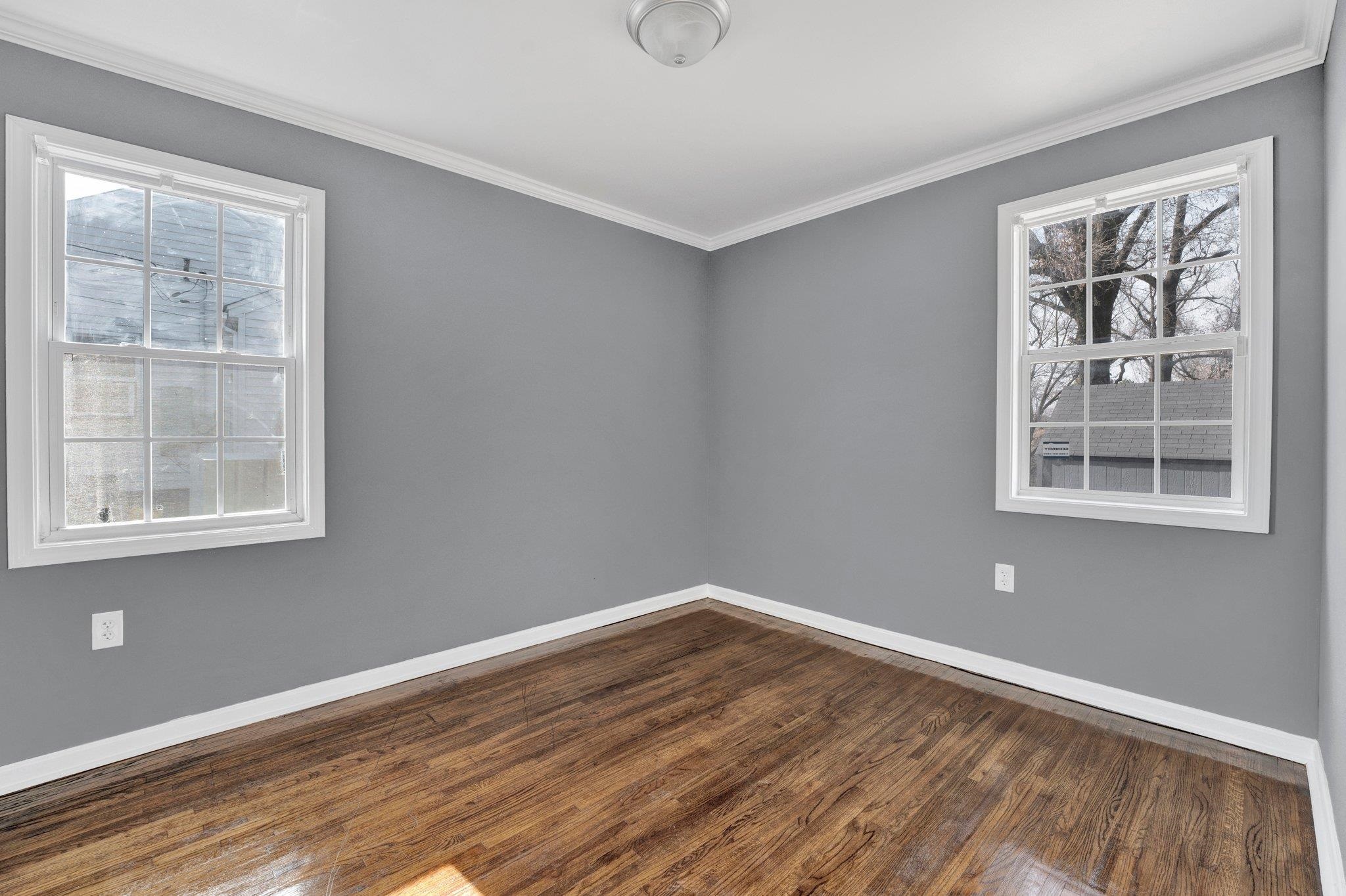 2161 Charjean Road Memphis, TN 38114 - Photo 11 of 18 Unfurnished room with dark hardwood / wood-style floors and crown molding