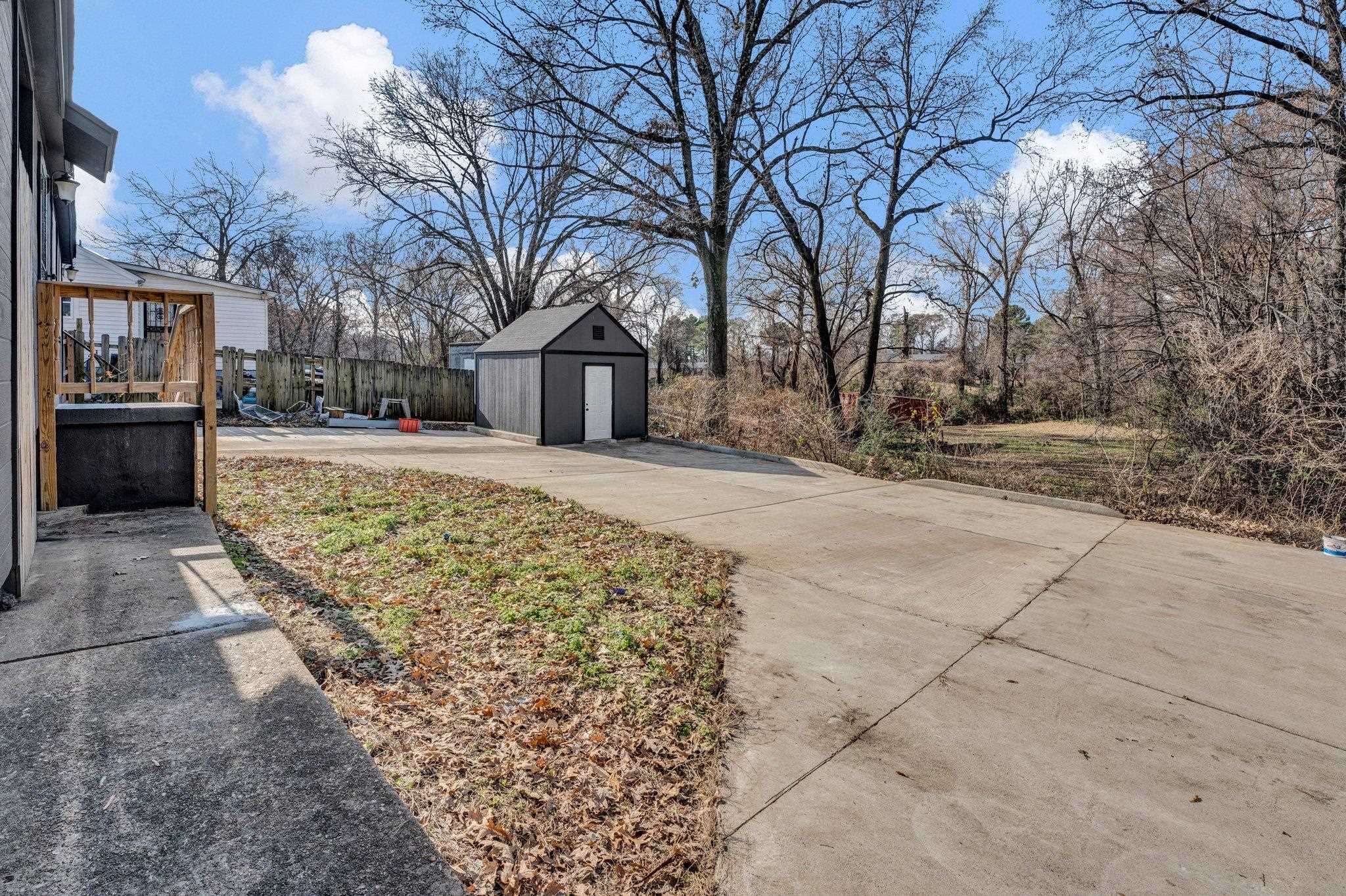 2161 Charjean Road Memphis, TN 38114 - Photo 13 of 18 View of yard featuring a shed