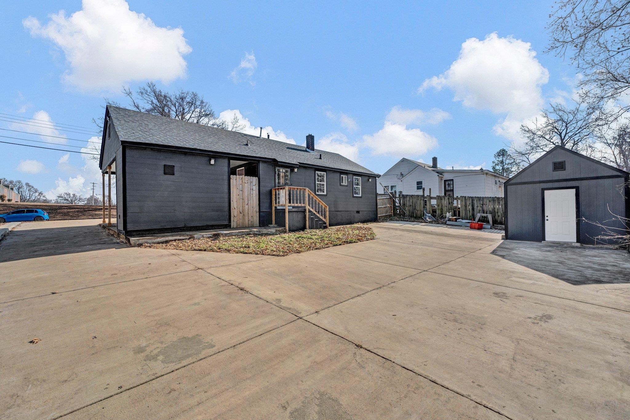 2161 Charjean Road Memphis, TN 38114 - Photo 14 of 18 Back of house featuring a shed and a patio area