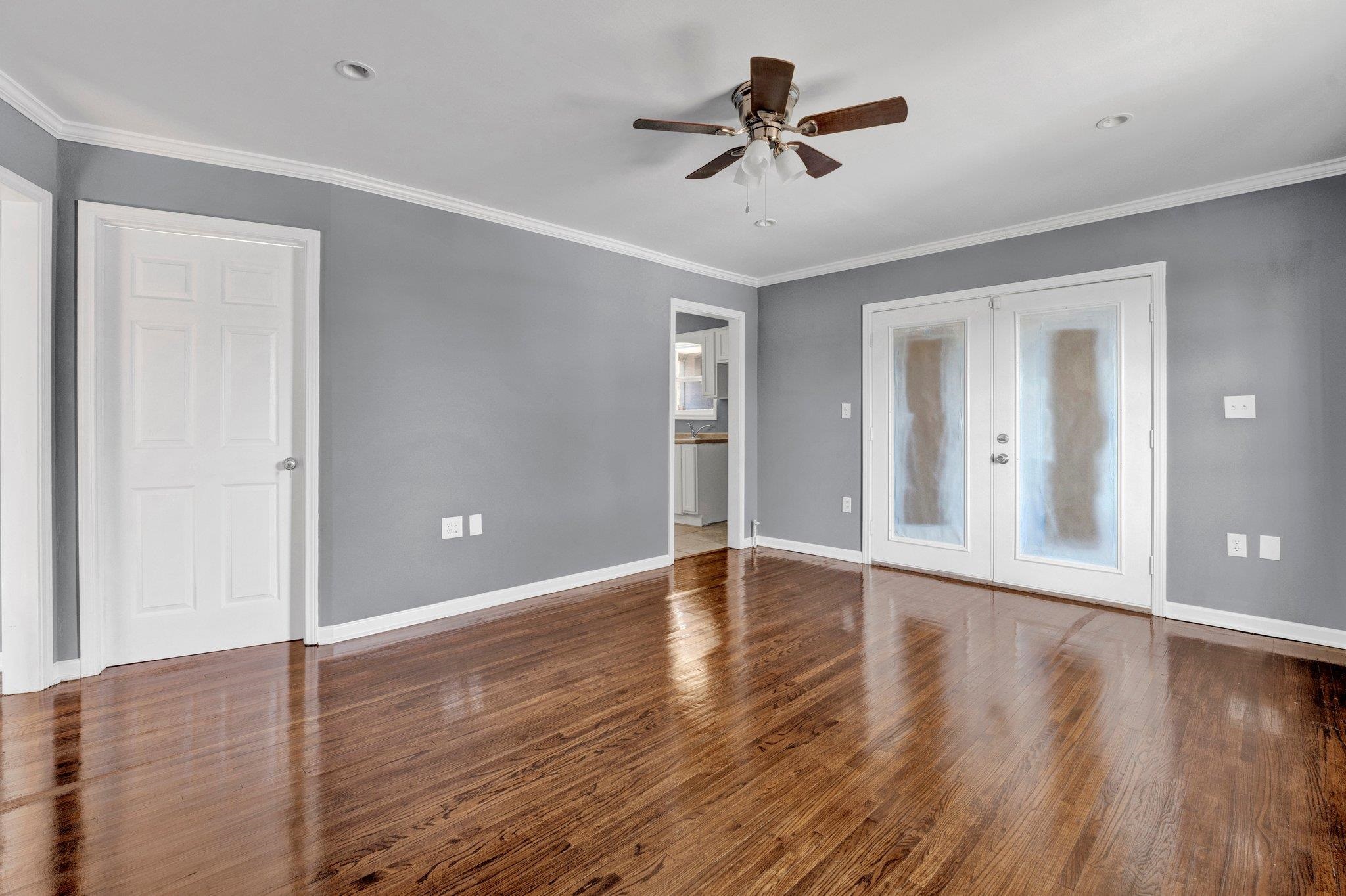 2161 Charjean Road Memphis, TN 38114 - Photo 4 of 18 Unfurnished room with ceiling fan, ornamental molding, and french doors