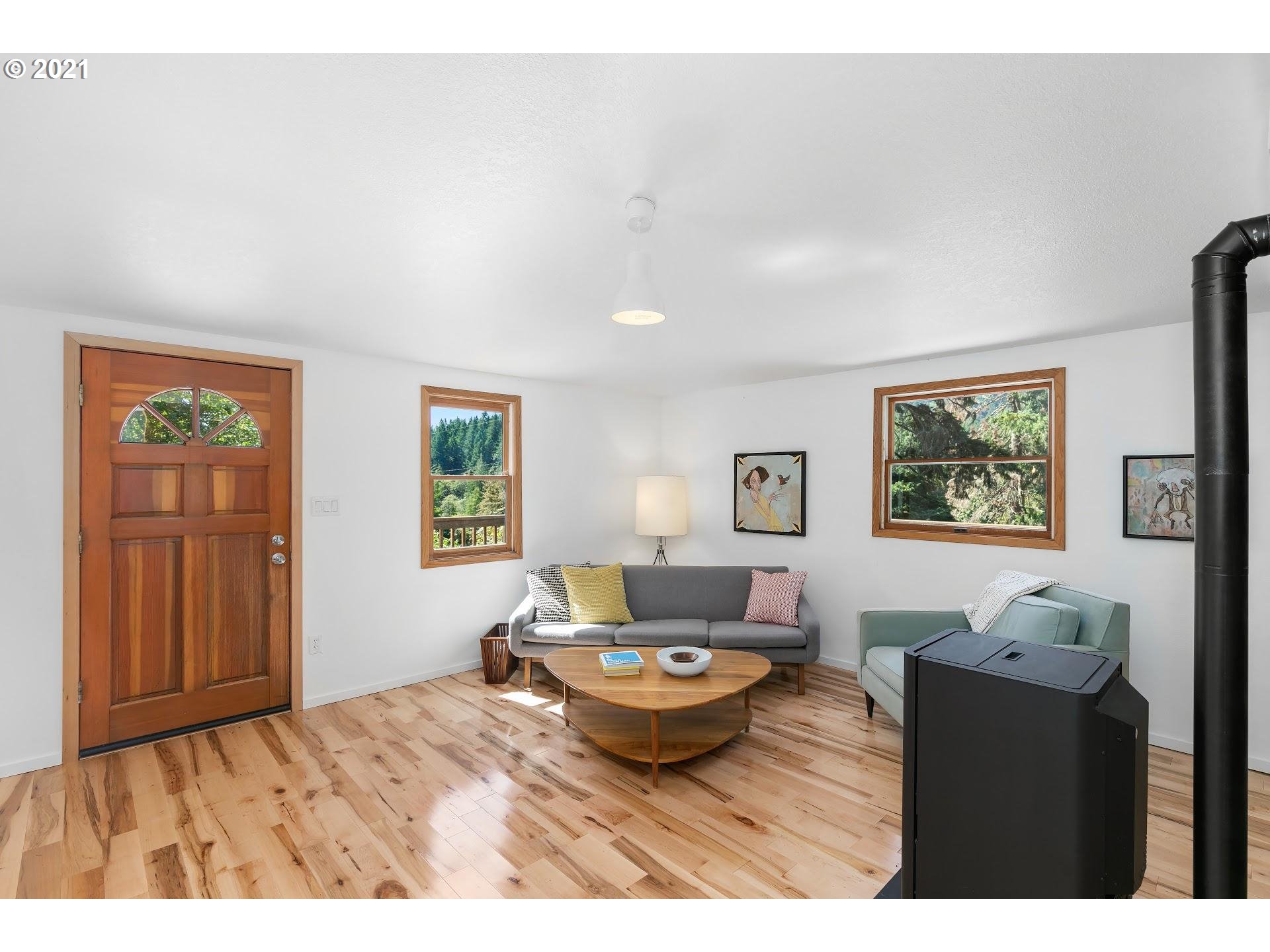 16436 Northwest Sheltered Nook Road Portland, OR 97231 - Photo 4 of 20 a living room with furniture and window