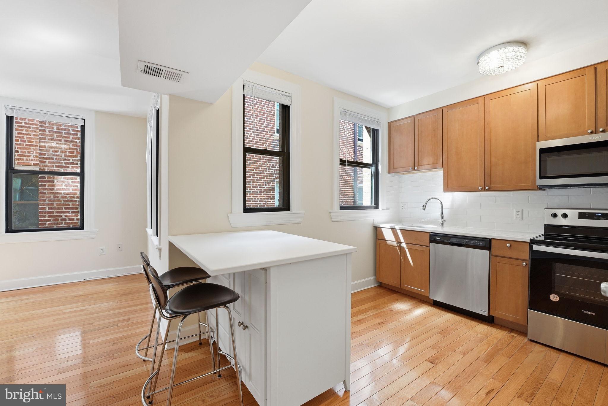 1858 California Street Northwest, Unit 33 Washington, DC 20009 - Photo 25 of 31 New Quartz Countertops and Subway Tiling