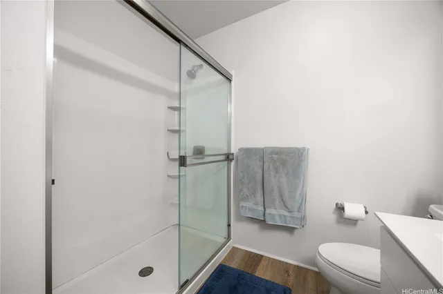 a bathroom with a shower and a toilet