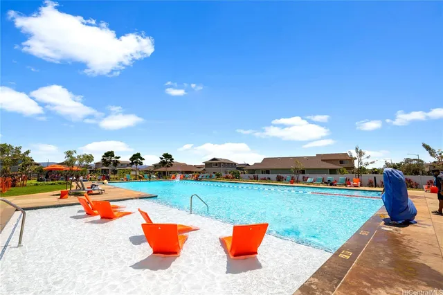 a view of a lake with houses in the back
