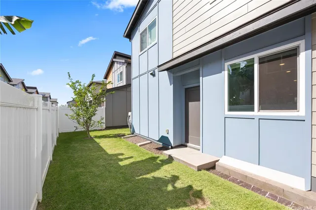 a view of a backyard with potted plants