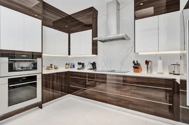 a kitchen with stainless steel appliances granite countertop a stove and a sink