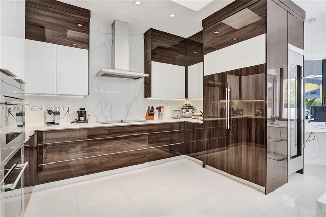 a kitchen with stainless steel appliances a refrigerator and cabinets