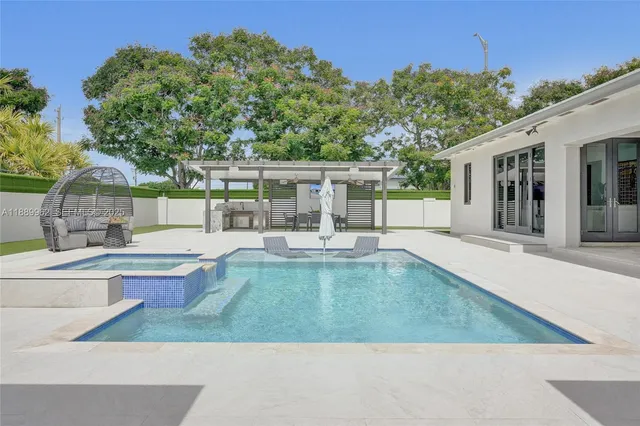 swimming pool view with a outdoor seating