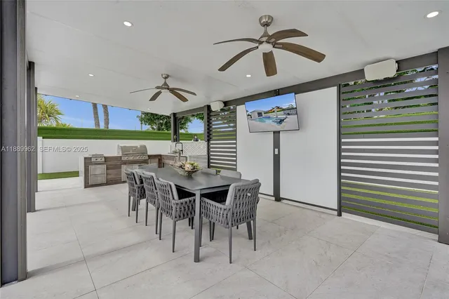 a view of a patio with a table and chairs