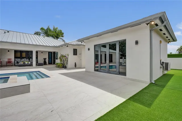 a bathroom with a sink a toilet a mirror and shower