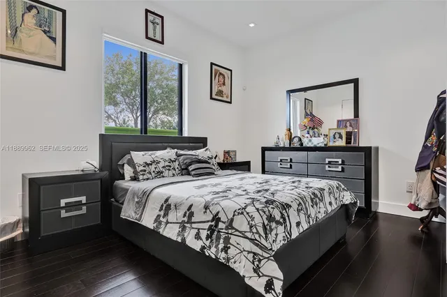 a bathroom with a double vanity sink mirror and shower