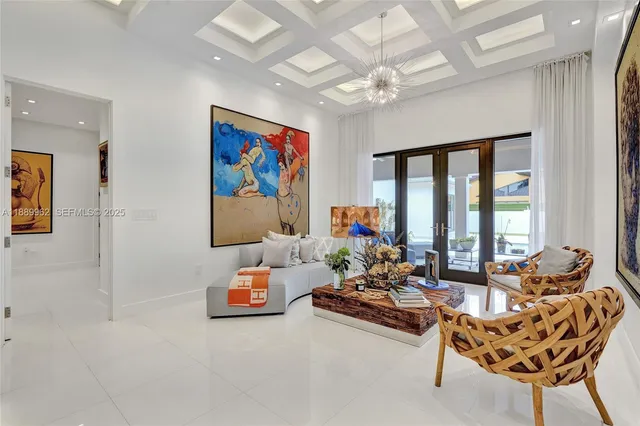 a reading room with furniture and a large window