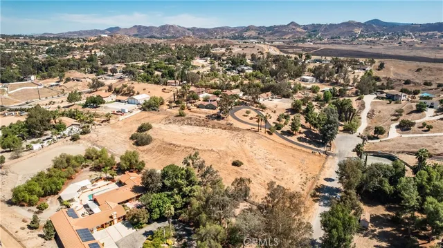 an aerial view of residential house with an outdoor space