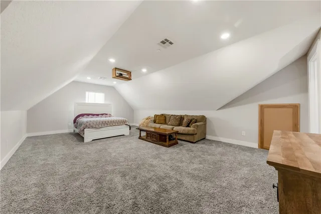 a bathroom with a toilet a sink a bathtub a mirror and vanity