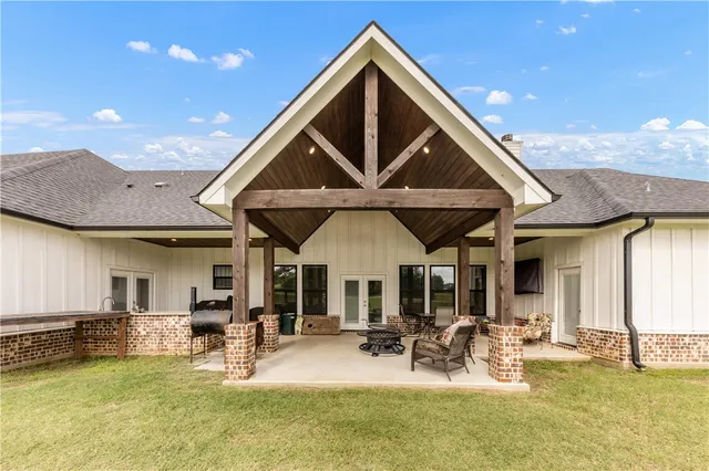 a front view of house with outdoor space and swimming pool