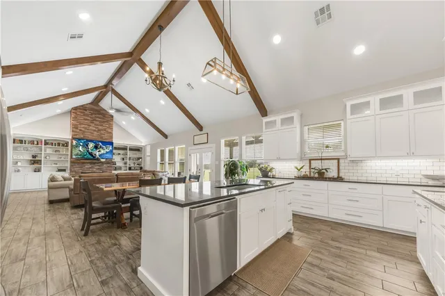 a kitchen with lots of counter top space and dining table
