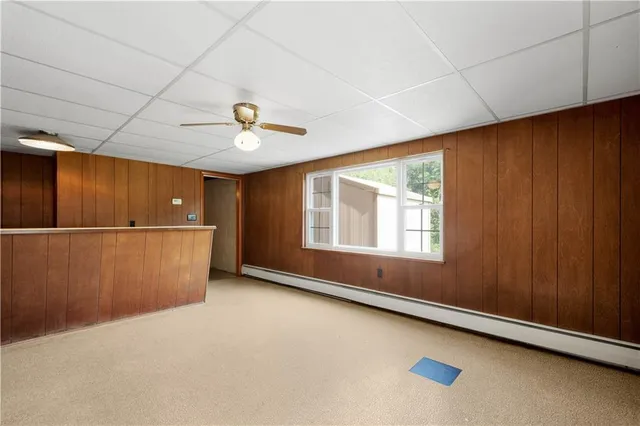 a view of a room with wooden walls