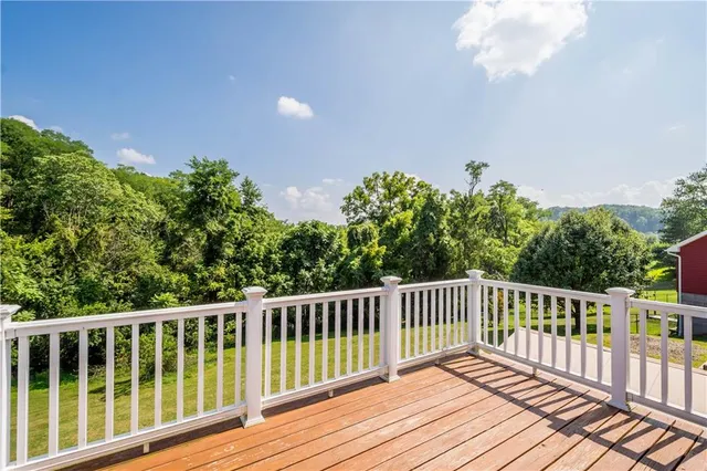 an aerial view of house with yard swimming pool and mountains