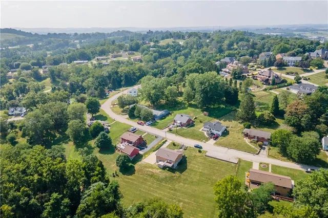 an aerial view of a house with mountain view