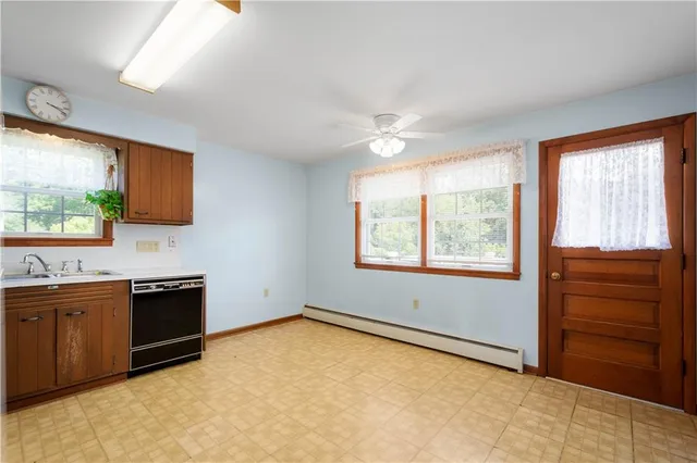 a kitchen with stainless steel appliances granite countertop a refrigerator stove and sink