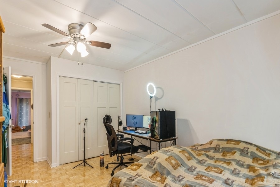 1001 Deerfield Road, Unit 204 Deerfield, IL 60015 - Photo 11 of 20 a bedroom with a bed and a chandelier