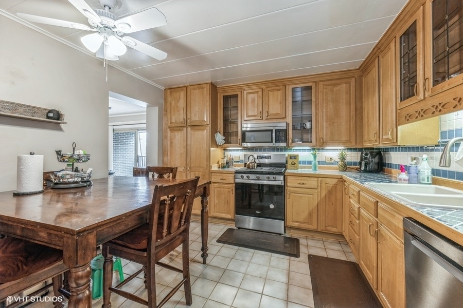 1001 Deerfield Road, Unit 204 Deerfield, IL 60015 - Photo 14 of 20 a kitchen with a stove a sink and a refrigerator