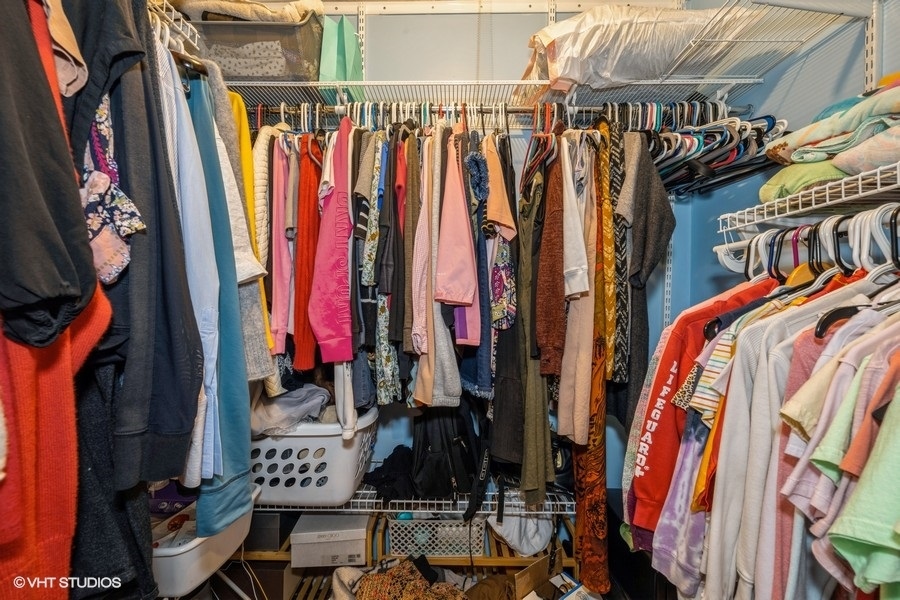 1001 Deerfield Road, Unit 204 Deerfield, IL 60015 - Photo 18 of 20 a view of walk in closet with clothes and shoes