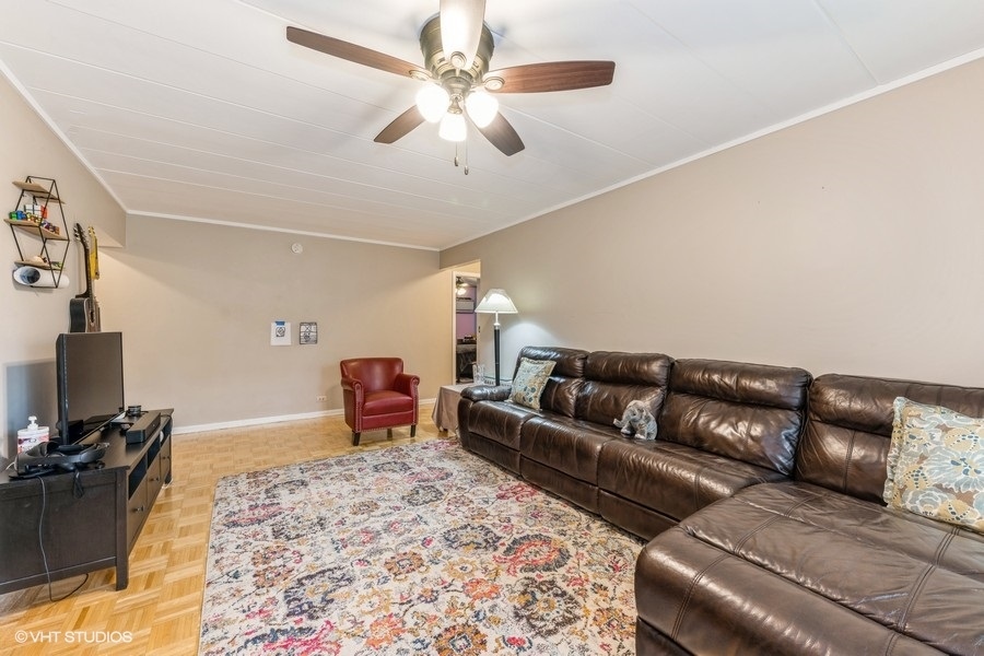 1001 Deerfield Road, Unit 204 Deerfield, IL 60015 - Photo 6 of 20 a living room with furniture and a flat screen tv
