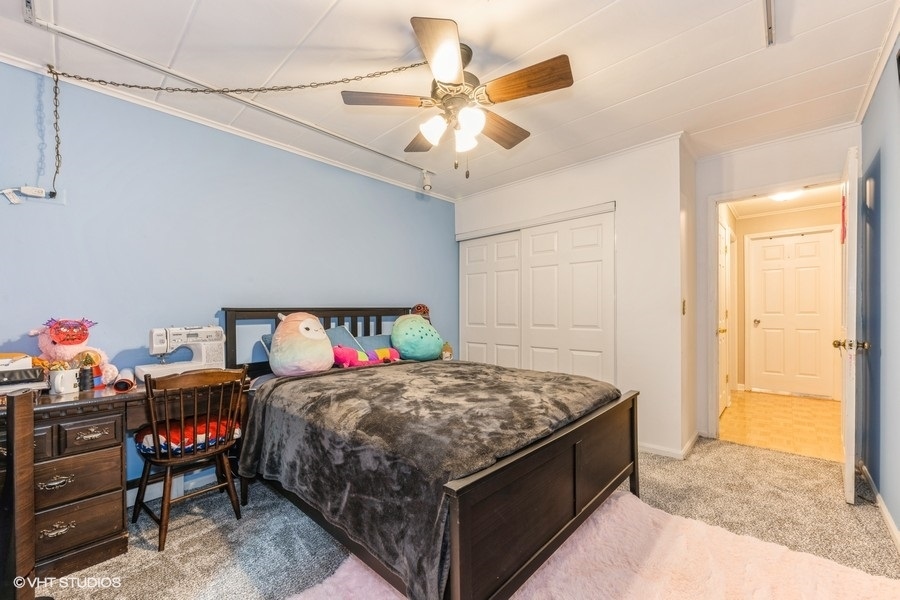 1001 Deerfield Road, Unit 204 Deerfield, IL 60015 - Photo 9 of 20 a bed room with a bed and a chandelier