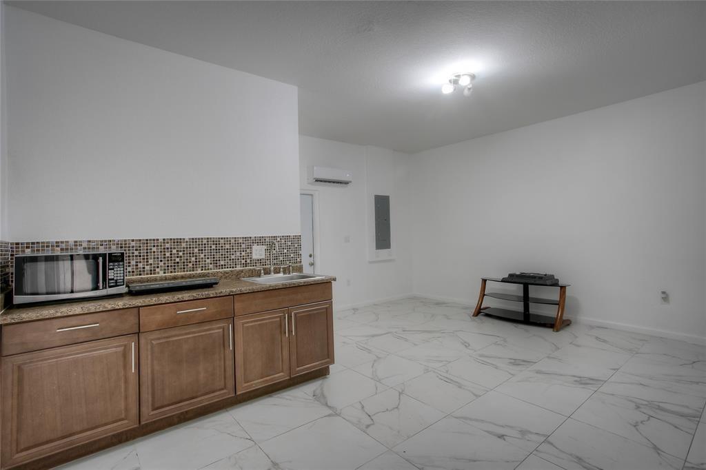 27775 Southwest 133rd Path Homestead, FL 33032 - Photo 12 of 16 a room with a sink and cabinets