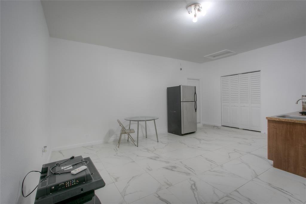 27775 Southwest 133rd Path Homestead, FL 33032 - Photo 13 of 16 a room with furniture and a table