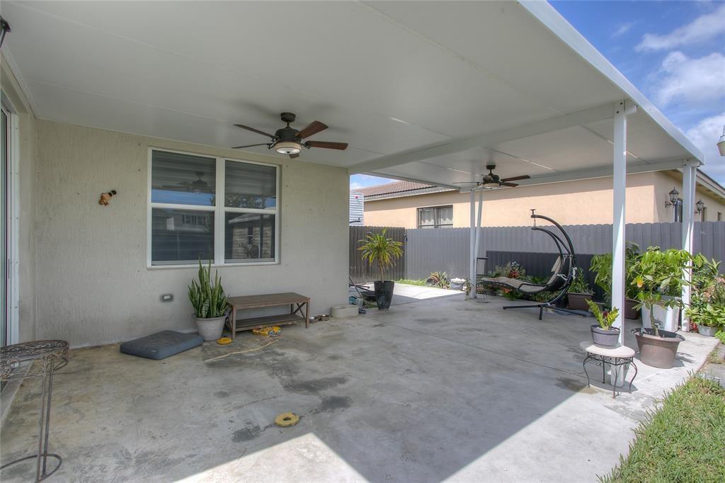 27775 Southwest 133rd Path Homestead, FL 33032 - Photo 14 of 16 a view of a room with gym equipment and potted plants