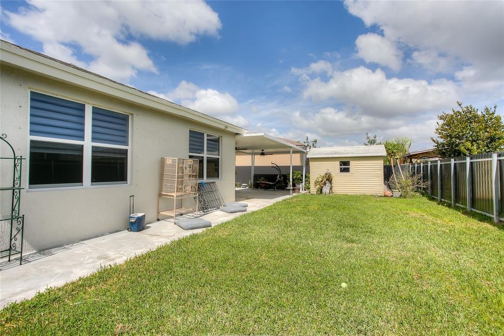 27775 Southwest 133rd Path Homestead, FL 33032 - Photo 15 of 16 a house view with a garden space